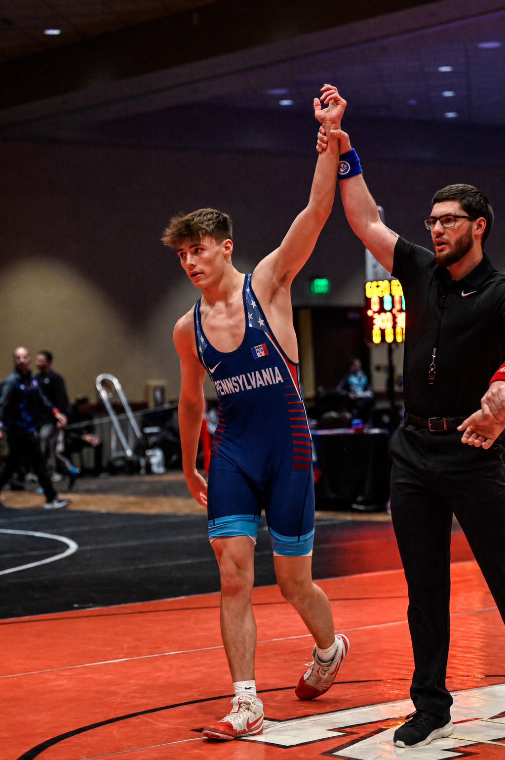 Weston Emmons celebrating a win in his Team Pennsylvania singlet